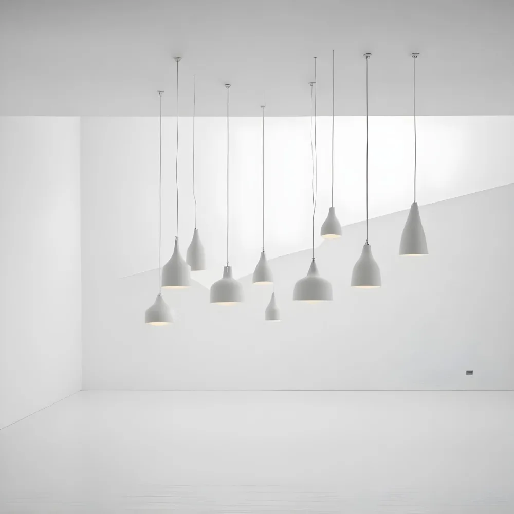 A Minimalist White Room With A High Ceiling And Hanging Pendant Lights 6 9481