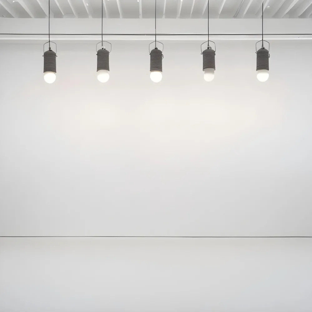 A Minimalist White Room With A High Ceiling And Hanging Pendant Lights 7 Abcb