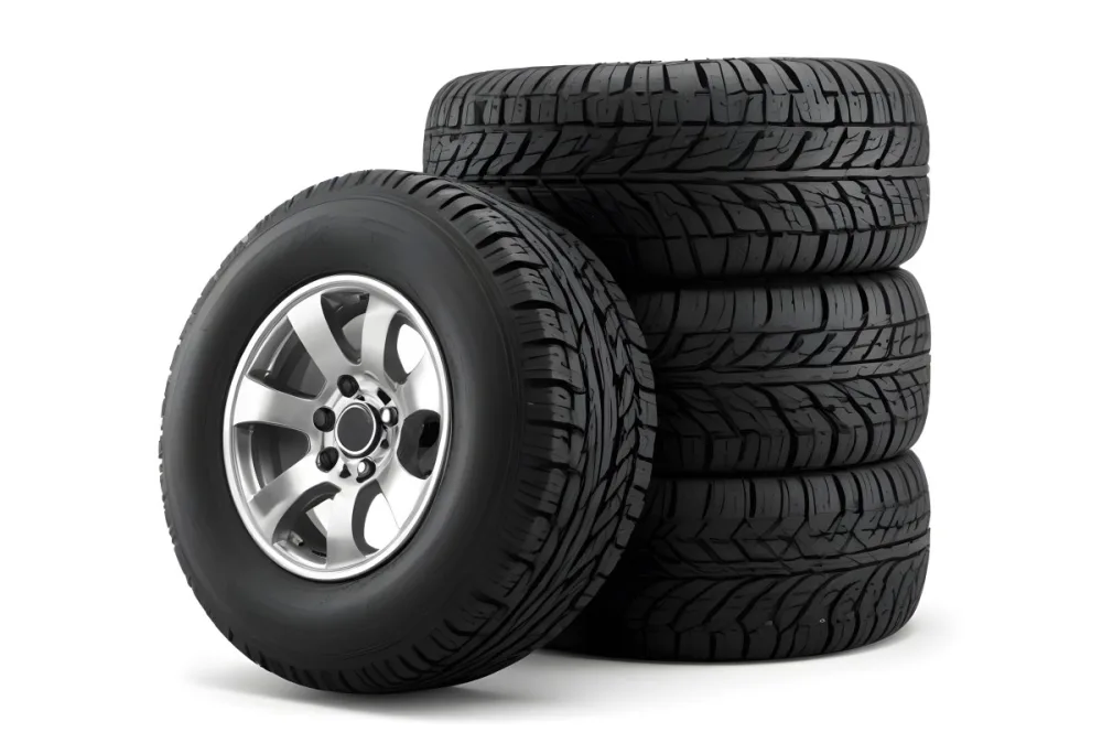 A Stack Of Four Black Tires With Black Rims One Tire Is Leaning Against The Stack The Background Is Black 24 867f
