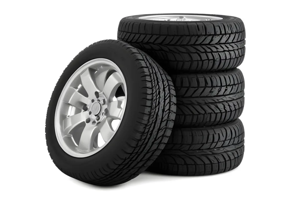 A Stack Of Four Black Tires With Black Rims One Tire Is Leaning Against The Stack The Background Is Black 30 Ab79