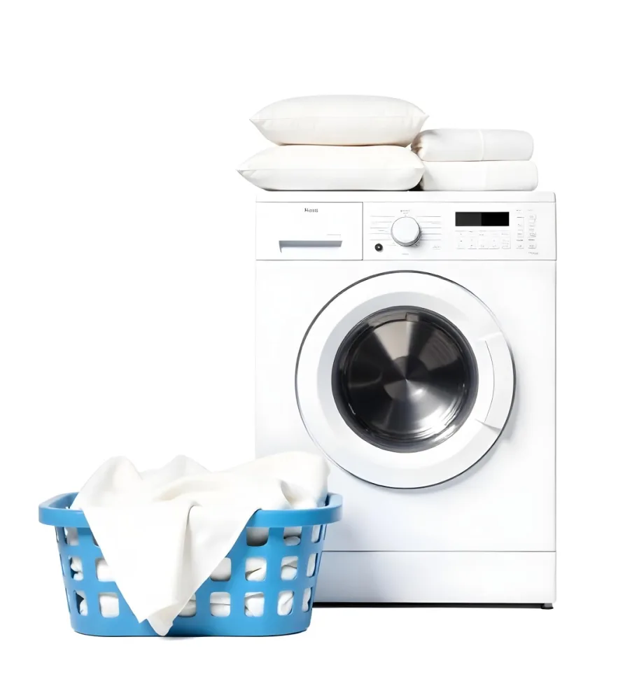 A White Washing Machine With Three White Pillows And Three Towels On Top A Blue Basket With White Clothes On A White Background 44 A519