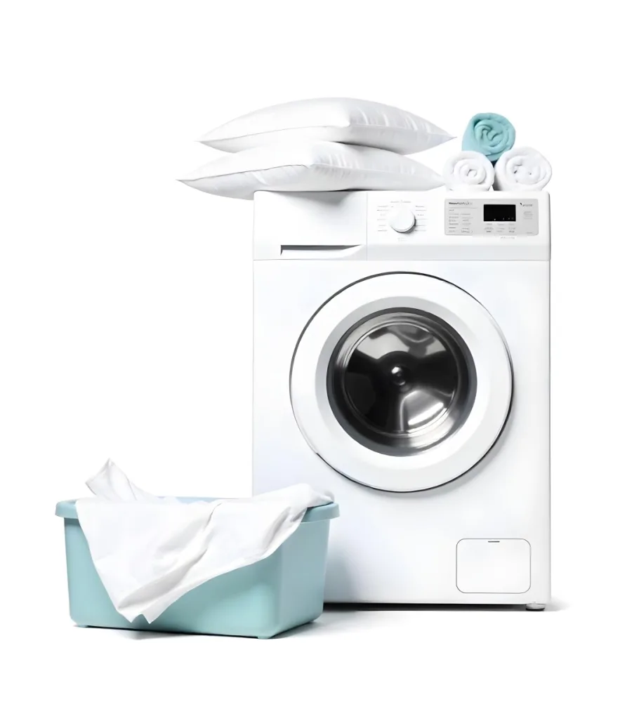 A White Washing Machine With Three White Pillows And Three Towels On Top A Blue Basket With White Clothes On A White Background 9 Daab