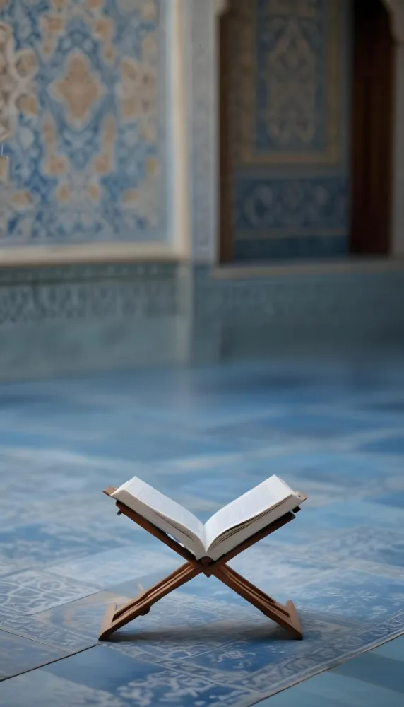 An Open Book Resting On A Wooden Stand Positioned On A Patterned Blue Floor The Background Features Blurred Architectural Elements Suggesting A Serene Indoor Space Possibly A Mosque Or A Similar Setting 20 Fb9e