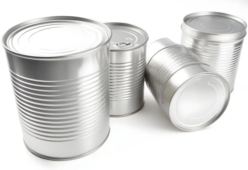 Four Silver Cans Of Different Sizes Some Standing And One Lying Down On A White Surface Studio Shot 37 B1b0