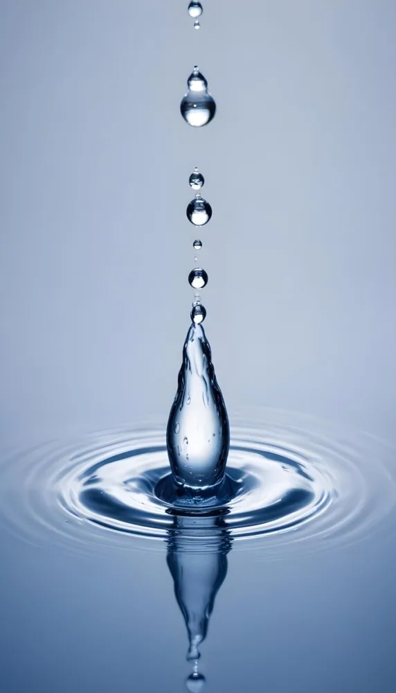 Minimal Soft Studio Light Photography A Close Up Of A Water Droplet Splashing On A Surface Creating A Circular Pattern With Ripples And Reflections High Detail Solid Bold Color Background 6 F7f6