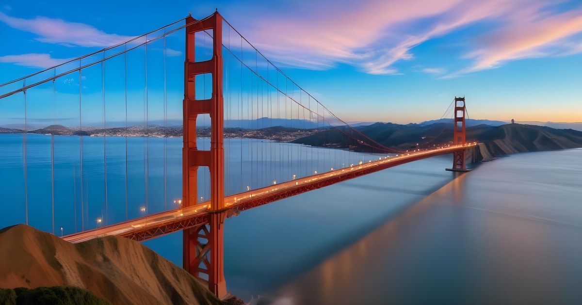 Golden Gate Bridge At Sunset With A Blue Sky And Clouds The Water Is Calm And Reflects The Colors Of The Sky 39 F6ae