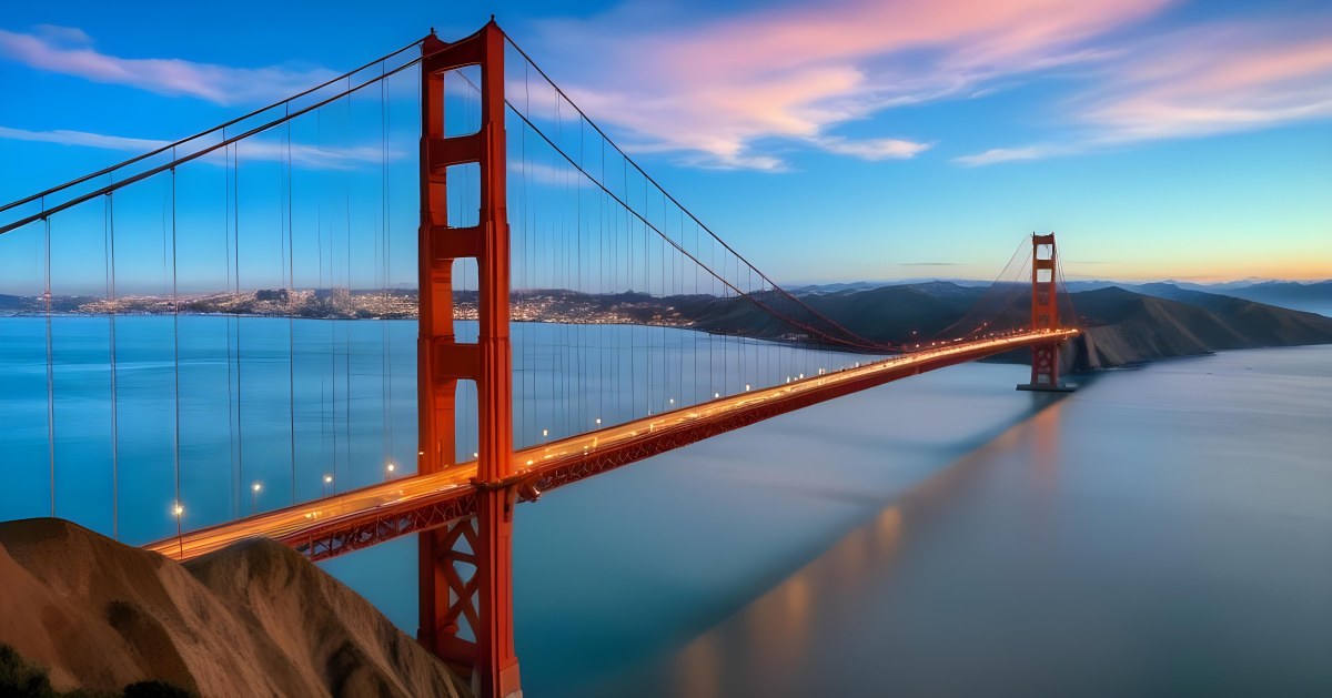 Golden Gate Bridge At Sunset With A Blue Sky And Clouds The Water Is Calm And Reflects The Colors Of The Sky 40 0081