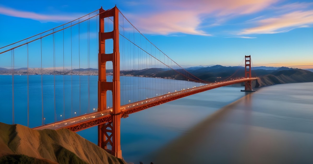 Golden Gate Bridge At Sunset With A Blue Sky And Clouds The Water Is Calm And Reflects The Colors Of The Sky 41 673a