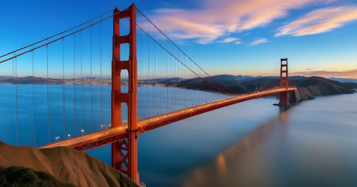 Golden Gate Bridge At Sunset With A Blue Sky And Clouds The Water Is Calm And Reflects The Colors Of The Sky 42 200a