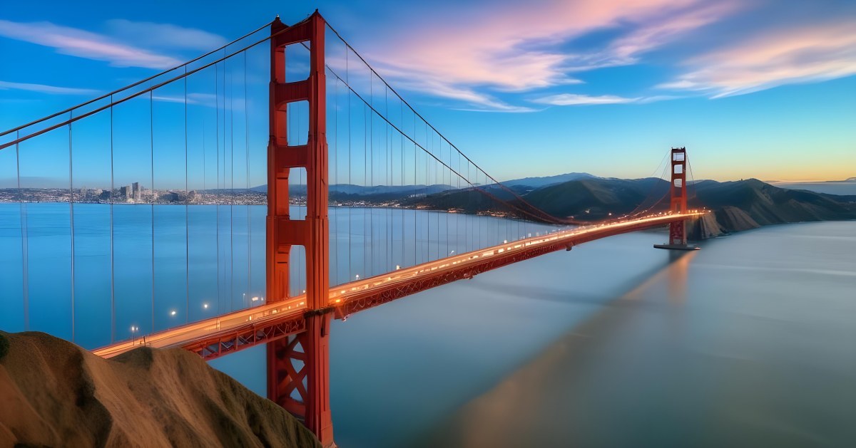 Golden Gate Bridge At Sunset With A Blue Sky And Clouds The Water Is Calm And Reflects The Colors Of The Sky 8 693d