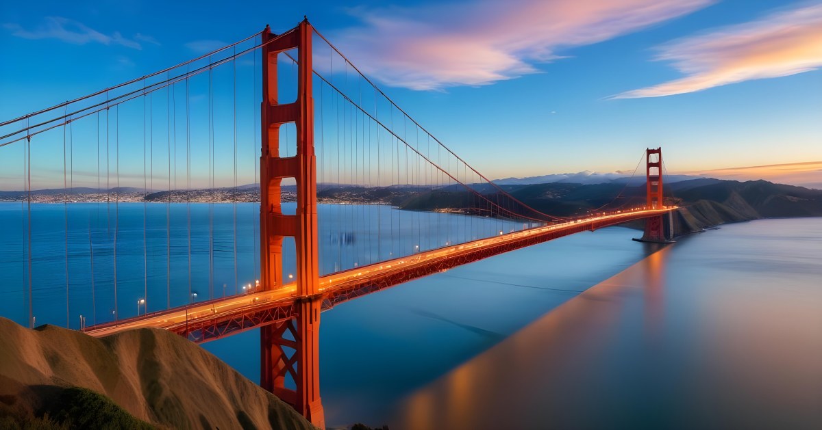 Golden Gate Bridge At Sunset With A Blue Sky And Clouds The Water Is Calm And Reflects The Colors Of The Sky 9 9a19