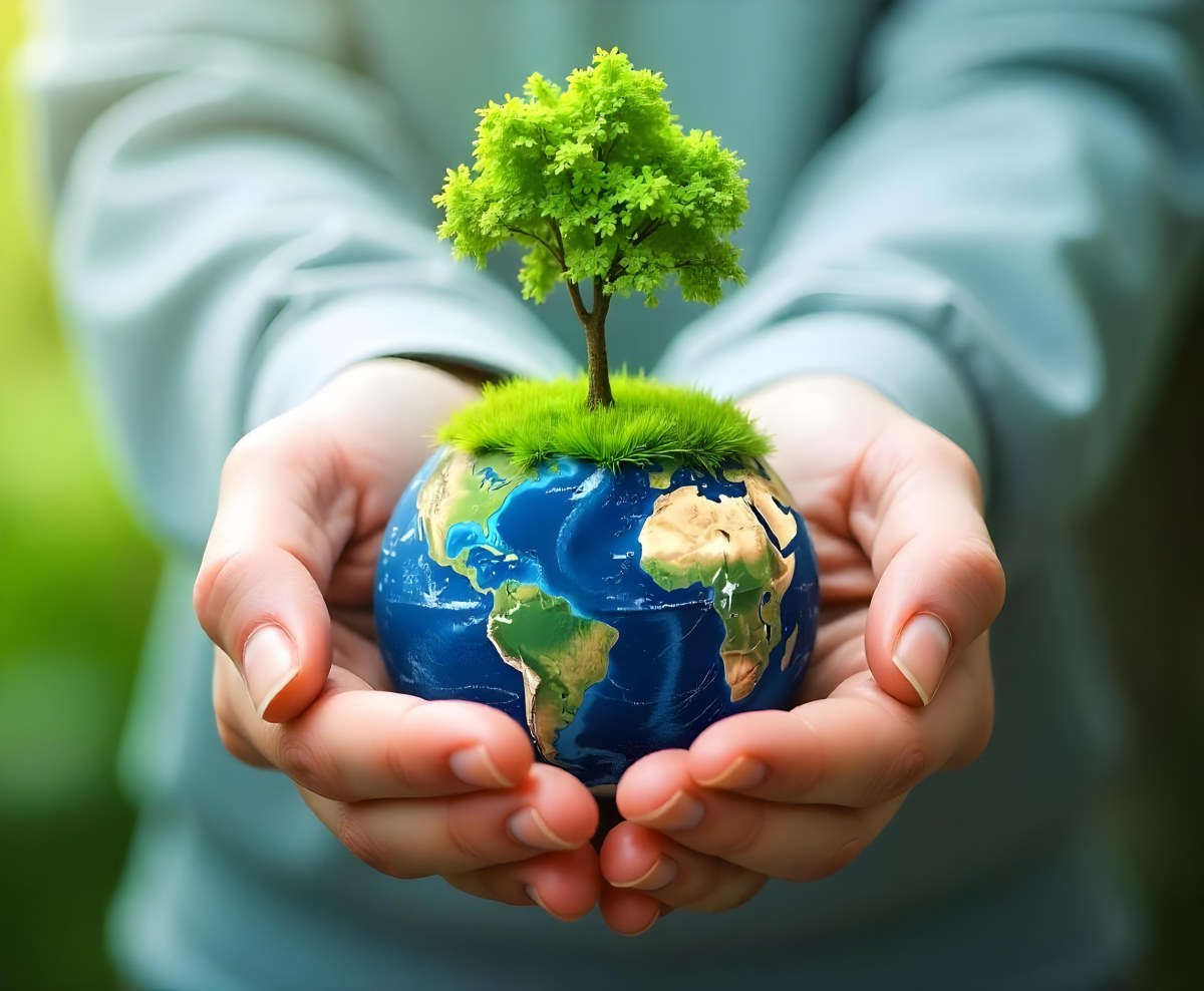 Hands Holding A Miniature Earth With A Tree Growing On Top A Patch Of Green Grass And A Cityscape In The Background 7 0894