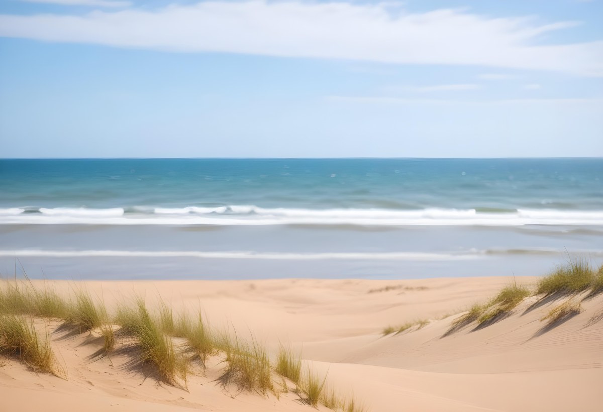 Sand Dunes On A Beach With A Blurred Blue Sky And Ocean In The Background 27 F039