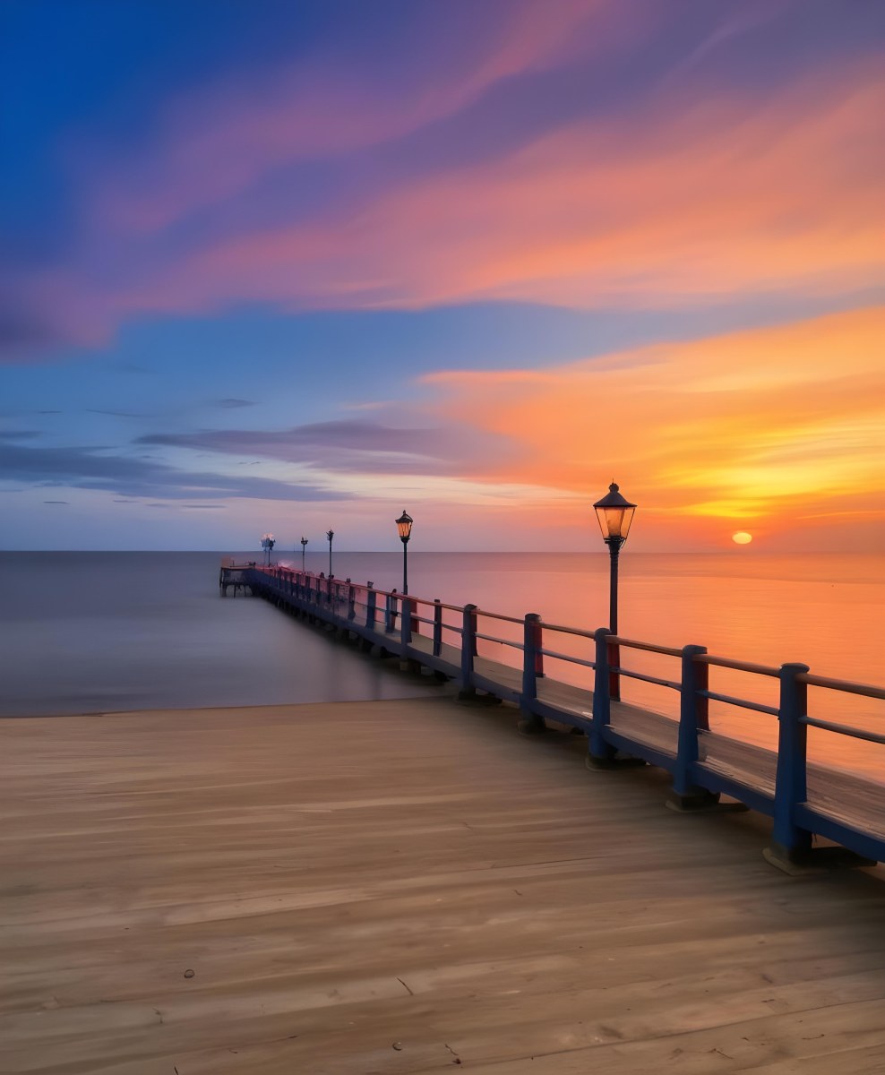 A Wooden Pier With Blue Railings And Lampposts Stretching Into The Ocean At Sunset The Sky Is A Mix Of Orange Pink And Blue 16 4a6d