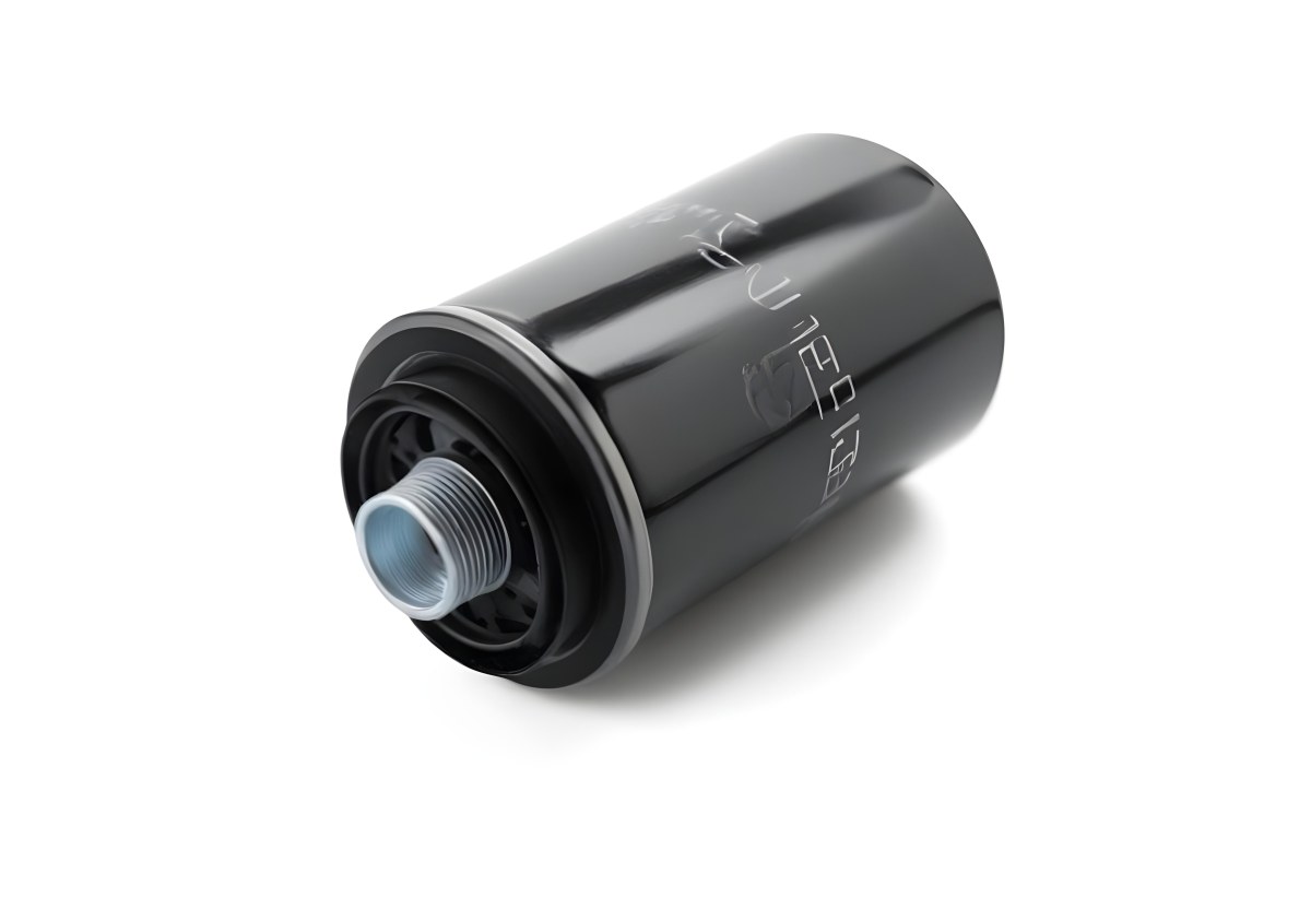 A Black Oil Filter With A Black Threaded Insert Lying On A Black Surface With A Slight Shadow Showcasing Its Cylindrical Shape And Construction 10 D3c3