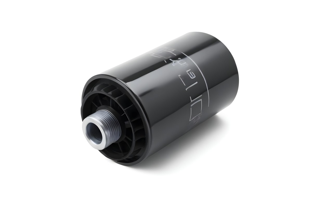 A Black Oil Filter With A Black Threaded Insert Lying On A Black Surface With A Slight Shadow Showcasing Its Cylindrical Shape And Construction 14 2362