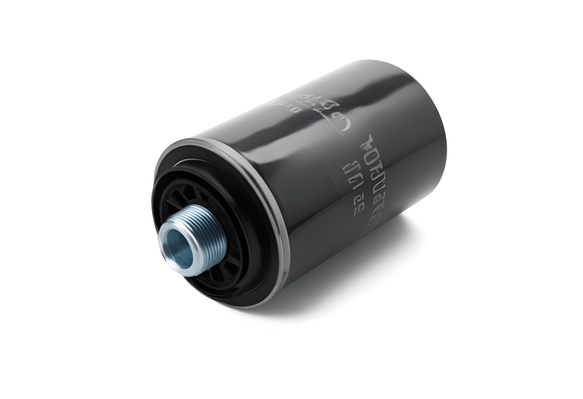 A Black Oil Filter With A Black Threaded Insert Lying On A Black Surface With A Slight Shadow Showcasing Its Cylindrical Shape And Construction 2 8381