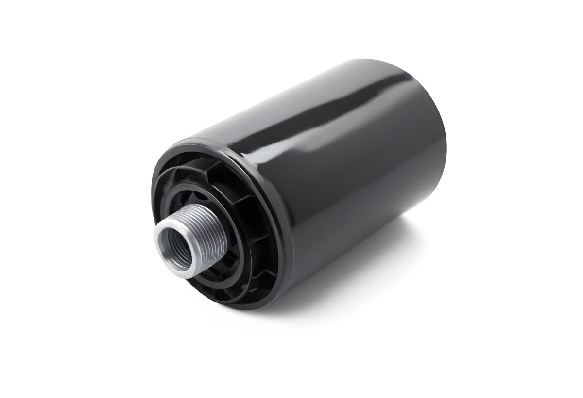 A Black Oil Filter With A Black Threaded Insert Lying On A Black Surface With A Slight Shadow Showcasing Its Cylindrical Shape And Construction 4 Ee1d