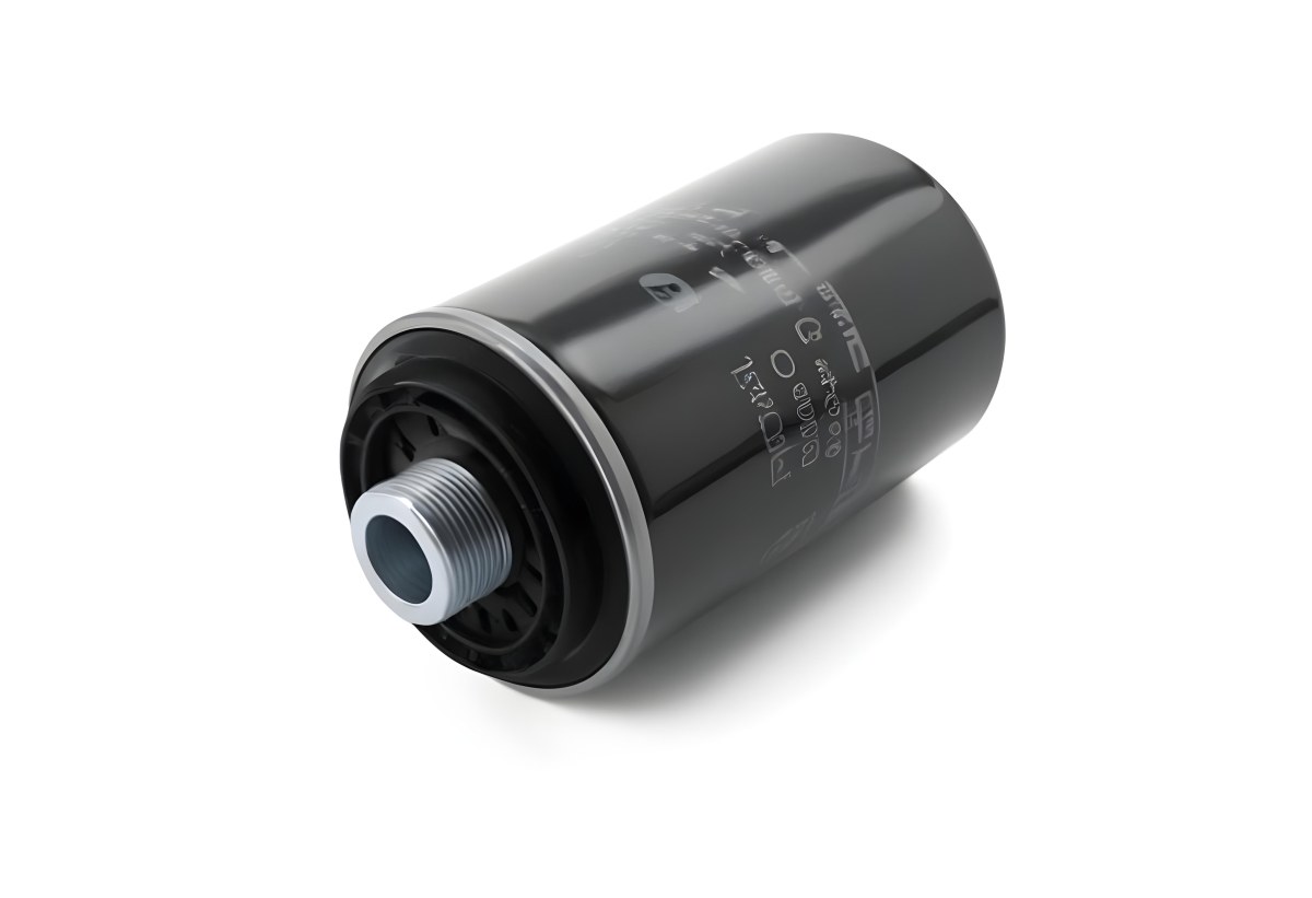 A Black Oil Filter With A Black Threaded Insert Lying On A Black Surface With A Slight Shadow Showcasing Its Cylindrical Shape And Construction 8 9dc8