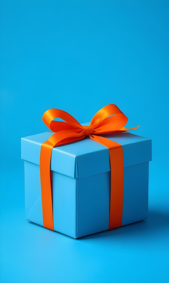 A Blue Gift Box With An Orange Ribbon On A Blue Background The Ribbon Is Tied In A Bow On Top Of The Box 5 Edae