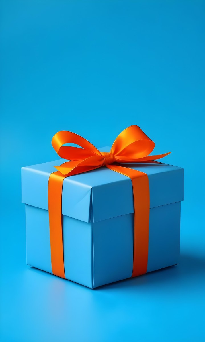 A Blue Gift Box With An Orange Ribbon On A Blue Background The Ribbon Is Tied In A Bow On Top Of The Box 9 Eddb