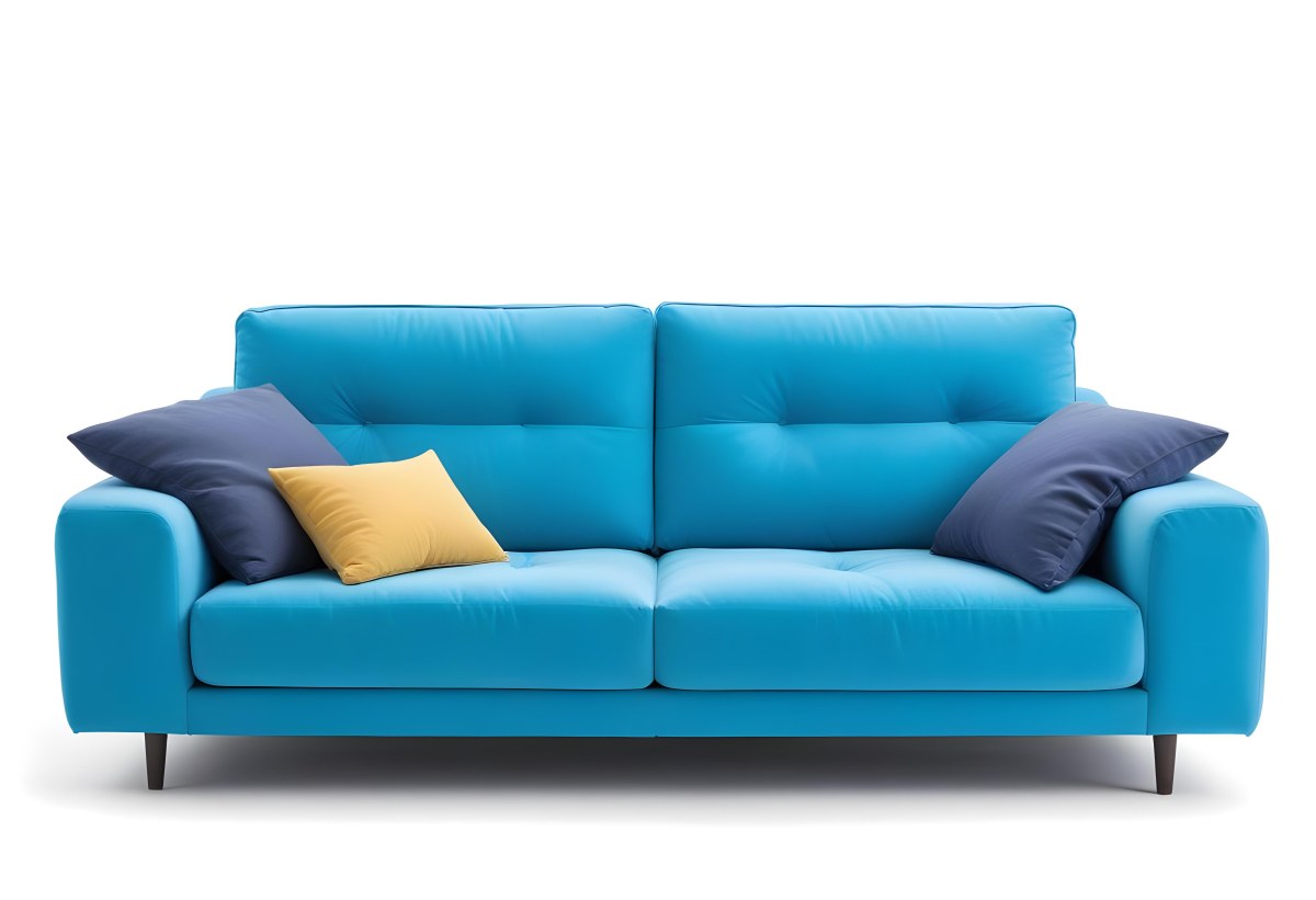A Blue Sofa With Two Pillows One White And One White In A White Background 5 556b