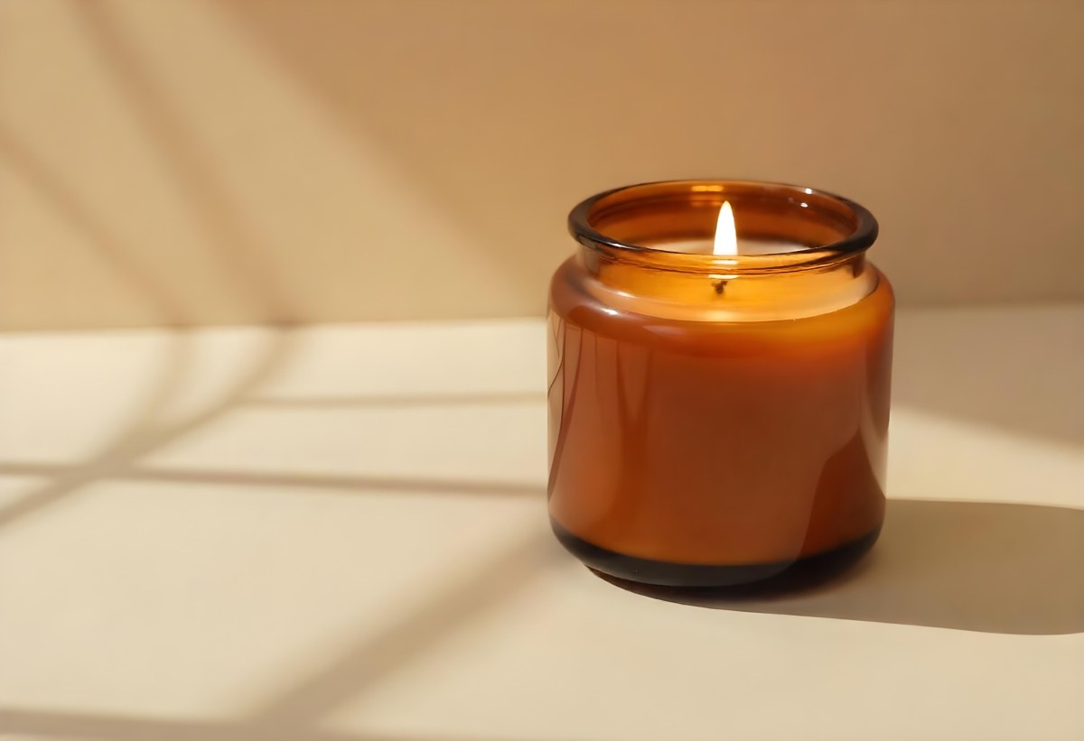 A Brown Glass Jar Candle