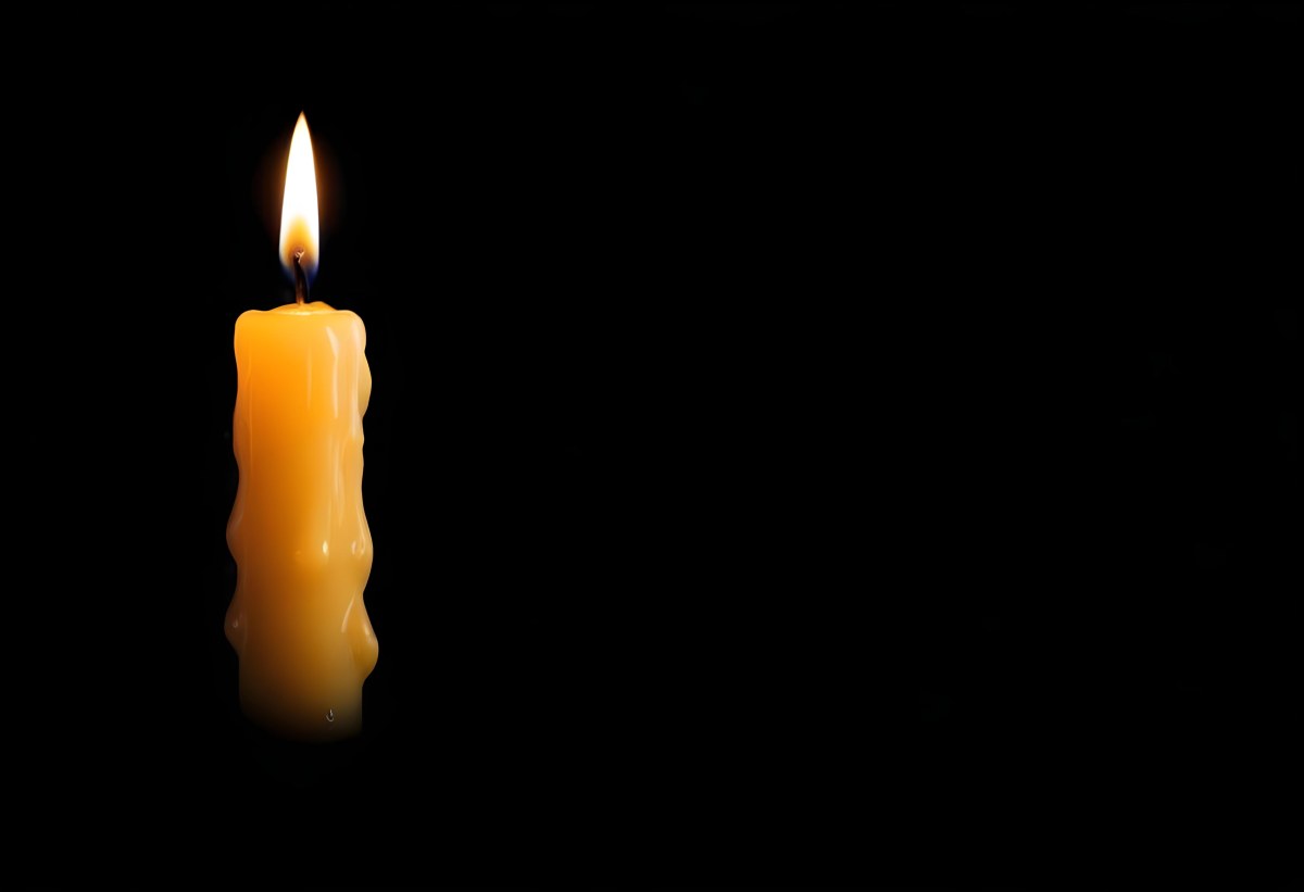 A Burning Candle With A Bright Flame The Wax Is Dripping Down The Side Casting A Warm Glow In A Dark Room 7 3827