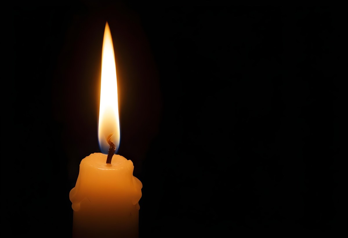 A Candle With A Bright Flame Casting A Warm Glow In The Darkness Creating A Sense Of Hope And Remembrance On A Black Background 15 Cfbb