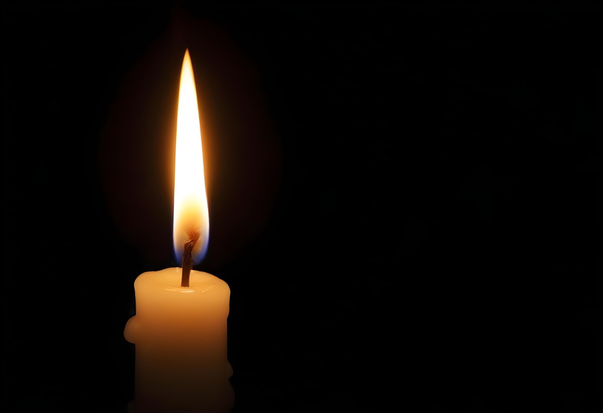 A Candle With A Bright Flame Casting A Warm Glow In The Darkness Creating A Sense Of Hope And Remembrance On A Black Background 17 1b75