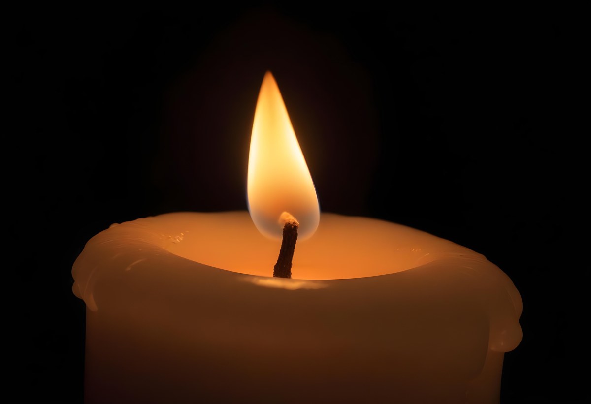 A Candle With A Bright Flame Casting A Warm Glow In The Darkness Creating A Sense Of Hope And Remembrance On A Black Background 19 D749