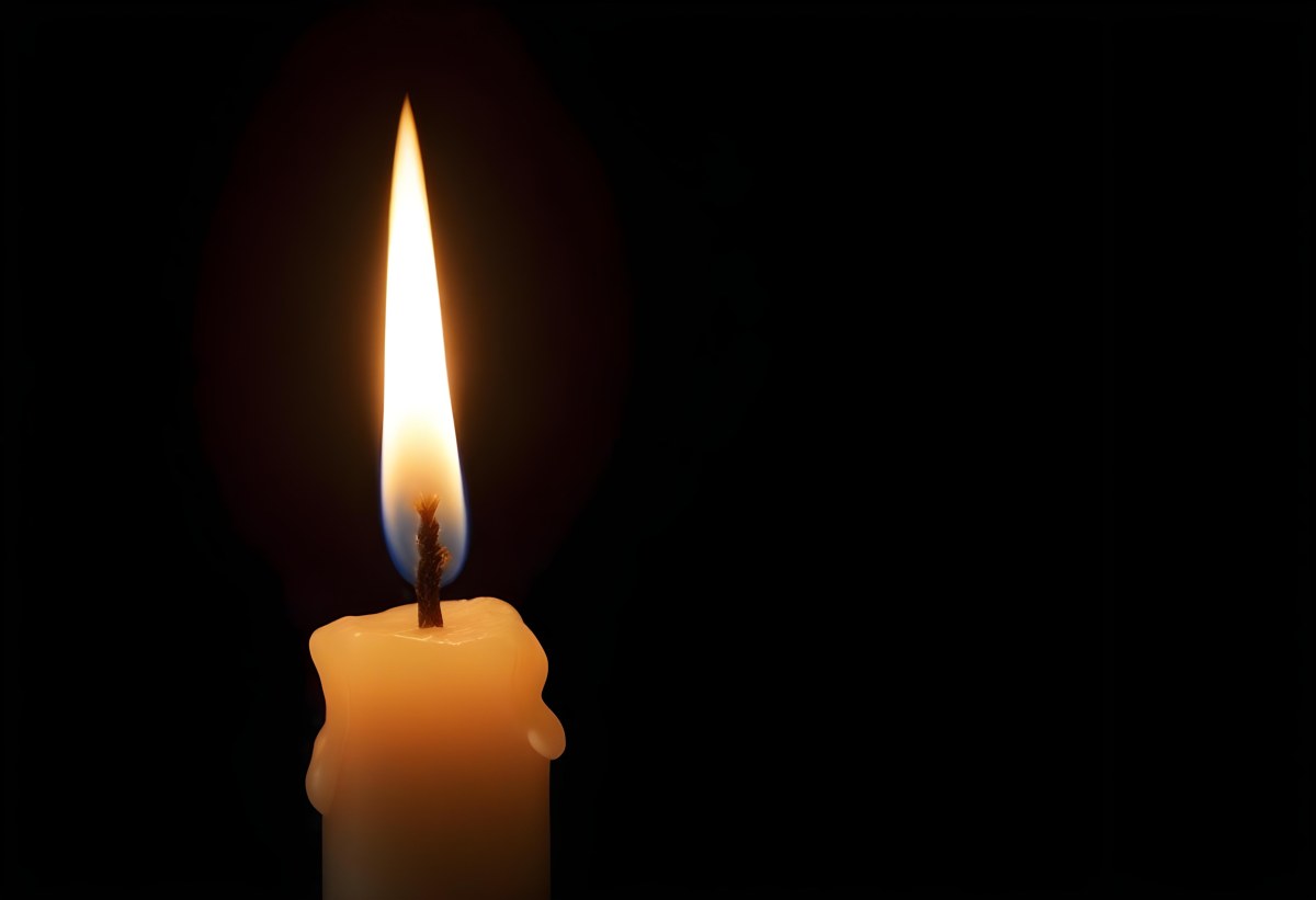 A Candle With A Bright Flame Casting A Warm Glow In The Darkness Creating A Sense Of Hope And Remembrance On A Black Background 20 Ec95