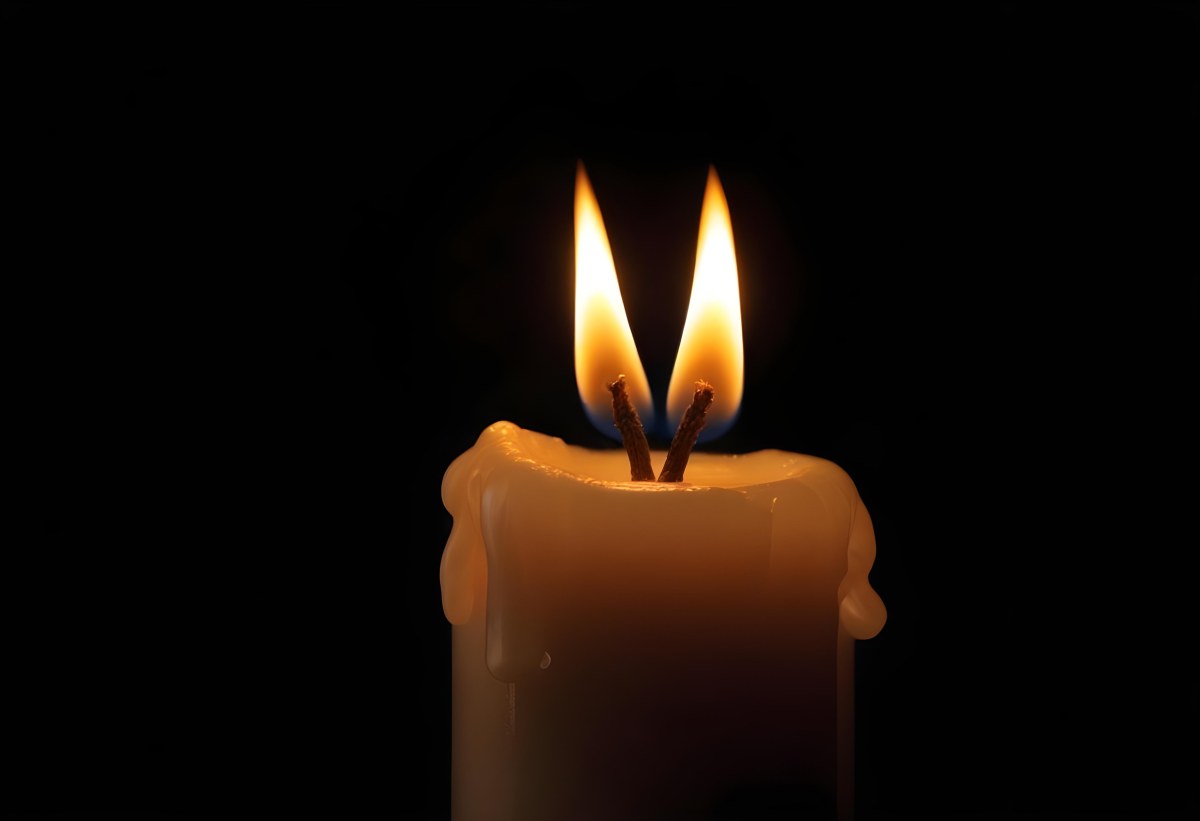 A Candle With A Bright Flame Casting A Warm Glow In The Darkness Creating A Sense Of Hope And Remembrance On A Black Background 21 4666
