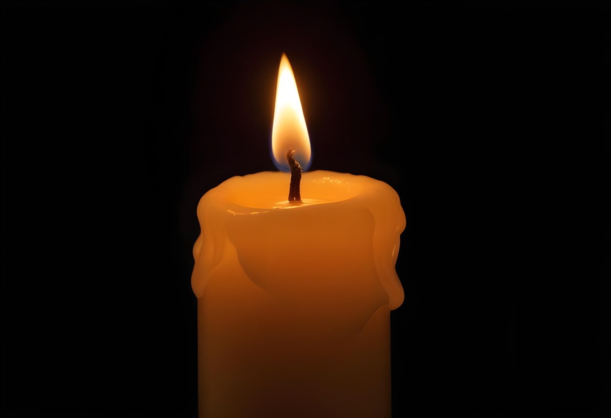 A Candle With A Bright Flame Casting A Warm Glow In The Darkness Creating A Sense Of Hope And Remembrance On A Black Background 25 Cd59