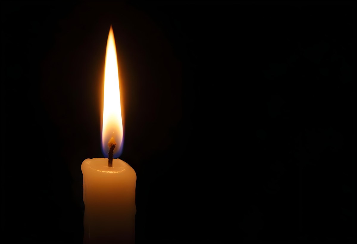 A Candle With A Bright Flame Casting A Warm Glow In The Darkness Creating A Sense Of Hope And Remembrance On A Black Background 3 A02c