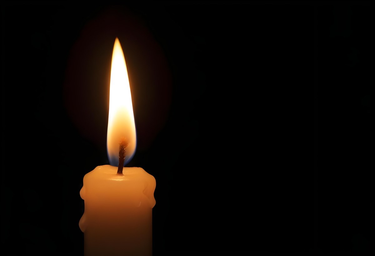 A Candle With A Bright Flame Casting A Warm Glow In The Darkness Creating A Sense Of Hope And Remembrance On A Black Background 4 6b79