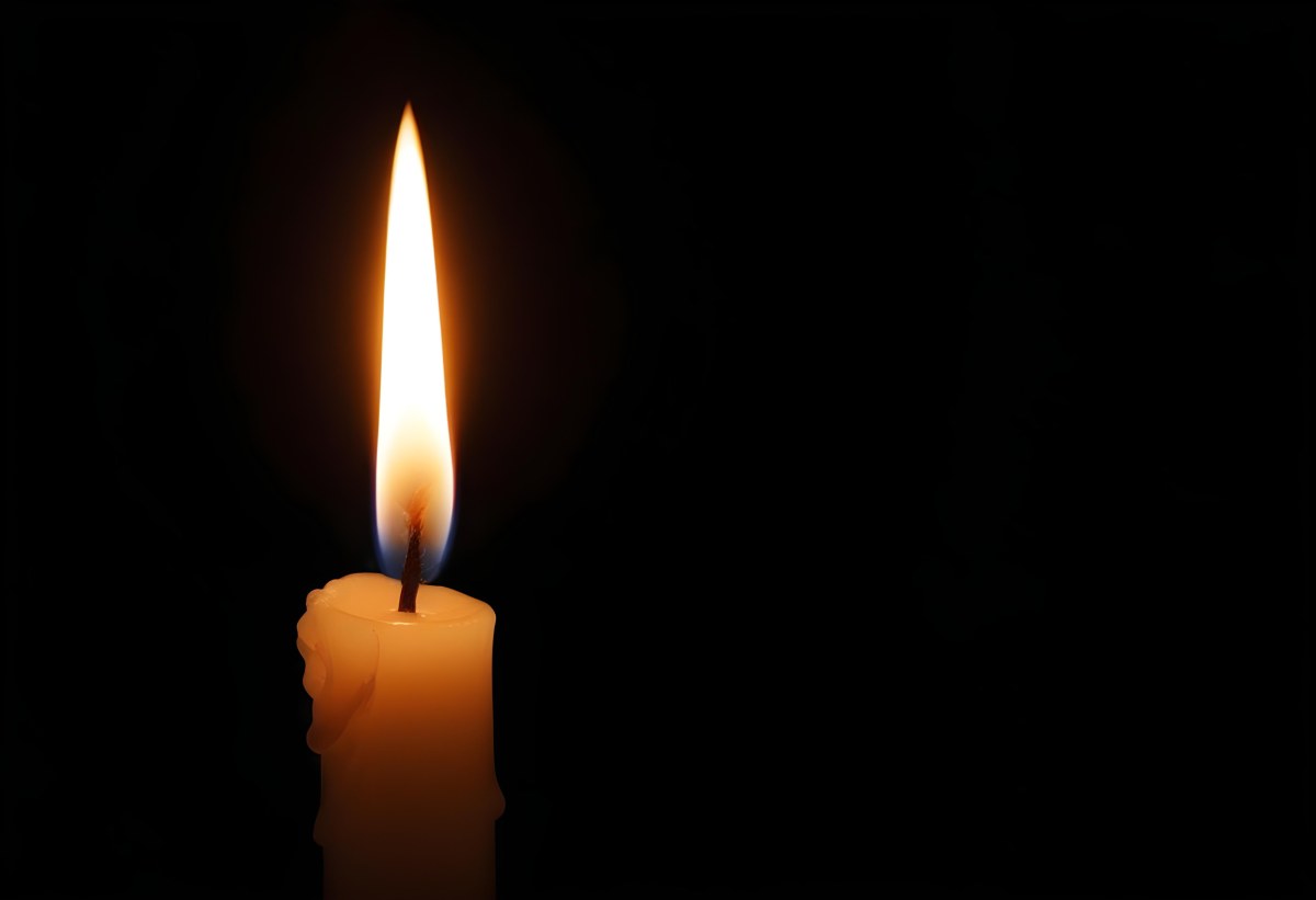 A Candle With A Bright Flame Casting A Warm Glow In The Darkness Creating A Sense Of Hope And Remembrance On A Black Background 5 4c5f