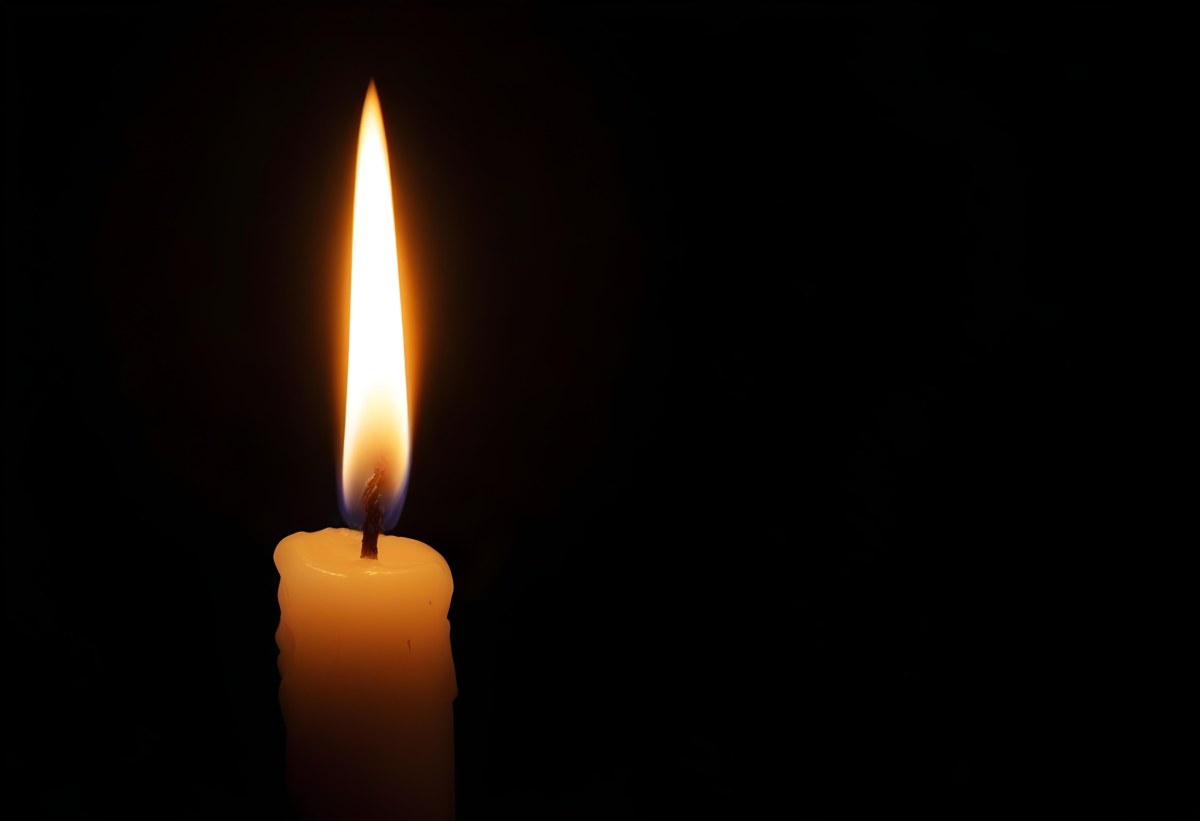 A Candle With A Bright Flame Casting A Warm Glow In The Darkness Creating A Sense Of Hope And Remembrance On A Black Background 7 6c73