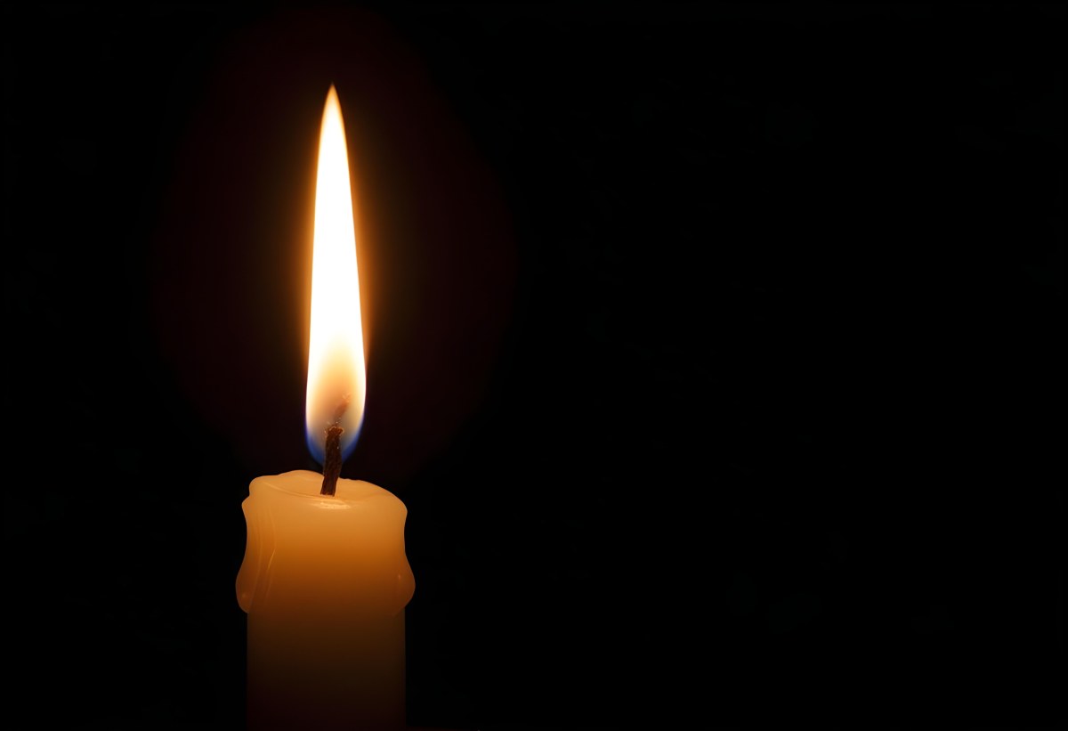 A Candle With A Bright Flame Casting A Warm Glow In The Darkness Creating A Sense Of Hope And Remembrance On A Black Background 8 F765