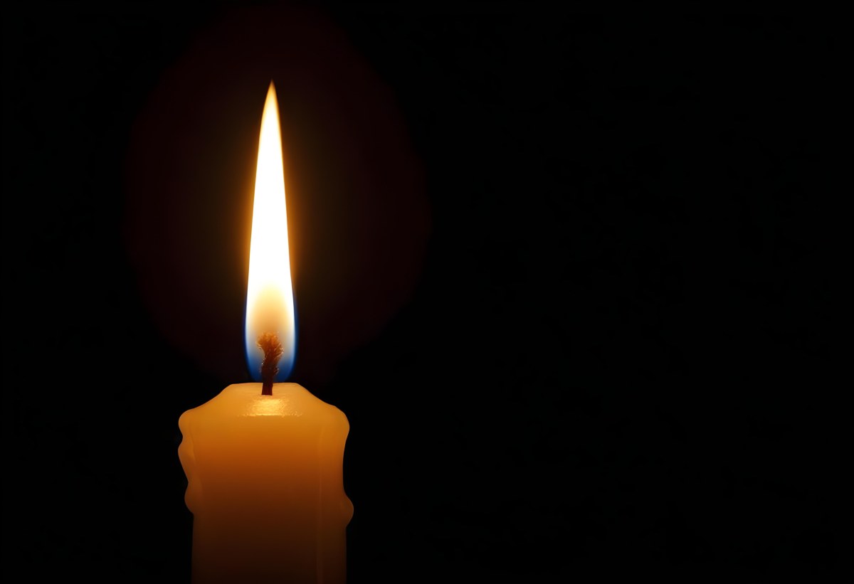 A Candle With A Bright Flame Casting A Warm Glow In The Darkness Creating A Sense Of Hope And Remembrance On A Black Background 9 1923