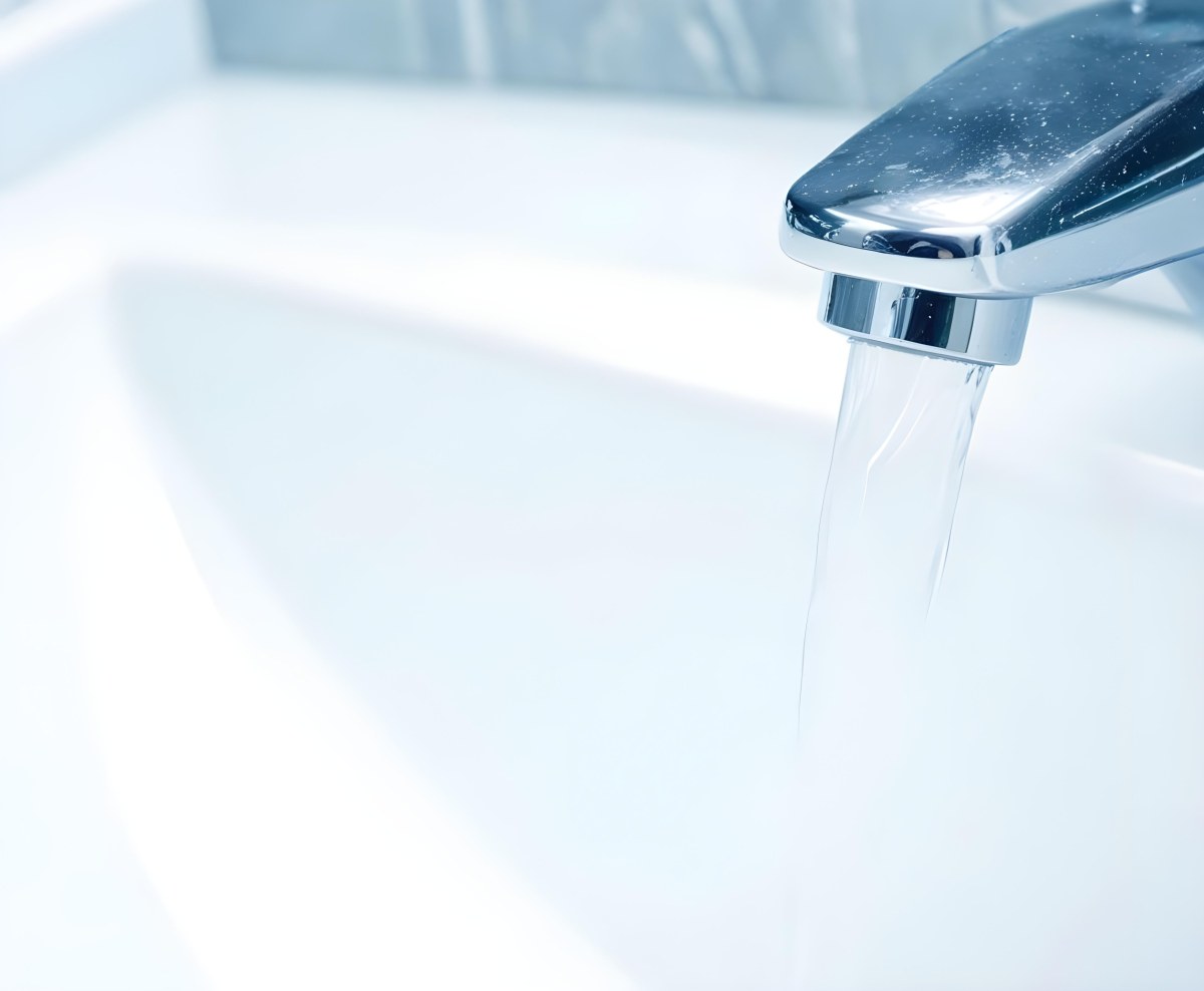 A Chrome Faucet With Water Running Into A White Sink The Background Is White 6 8fcd