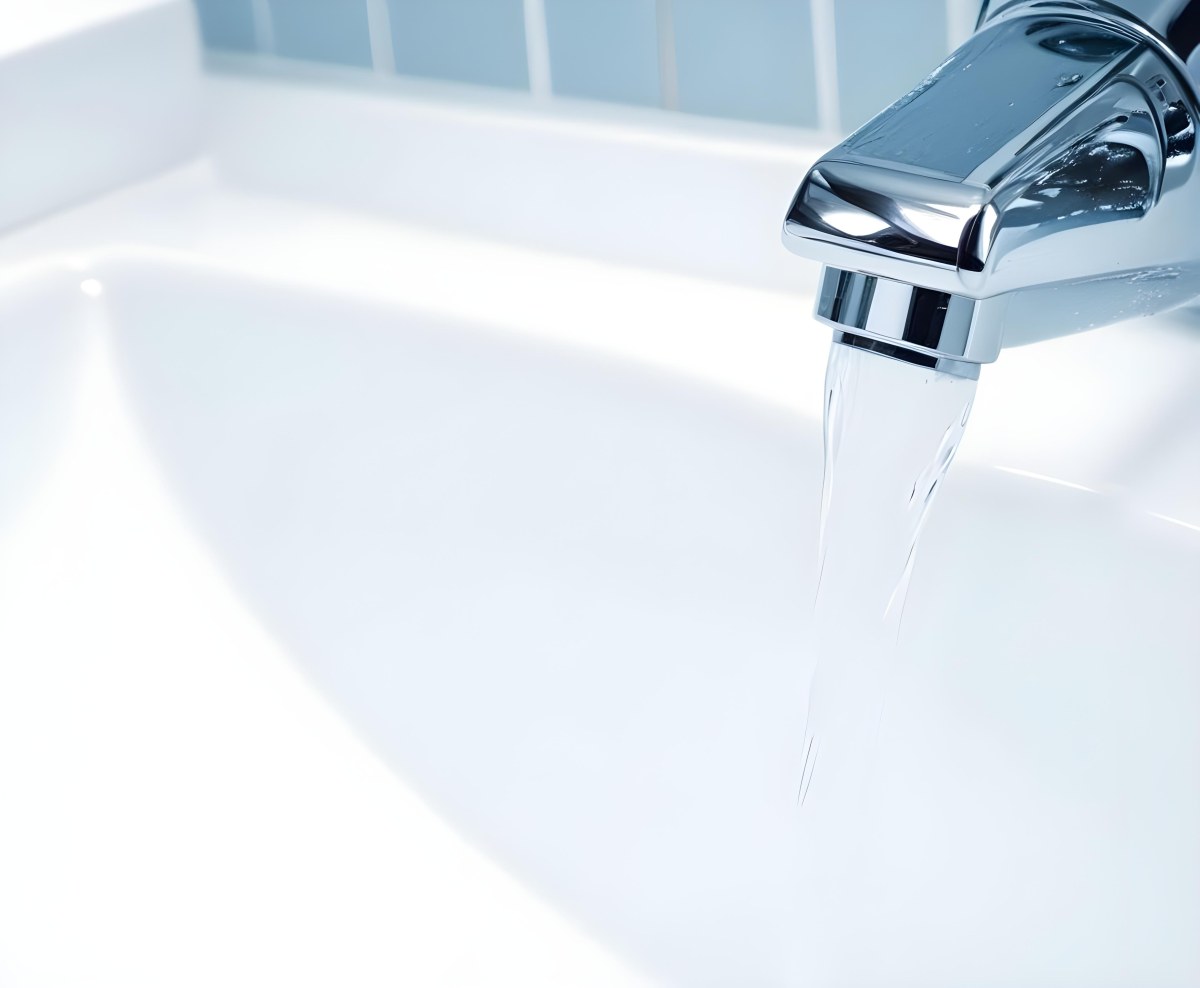 A Chrome Faucet With Water Running Into A White Sink The Background Is White 8 5361