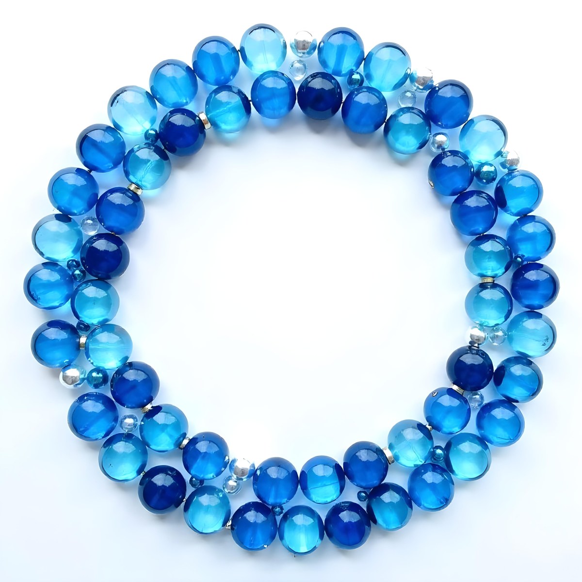 A Circular Arrangement Of Blue Gemstones Or Beads Against A White Background 5 5912