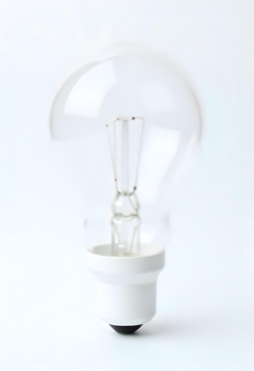 A Clear Light Bulb With Visible Filament And Internal Components Set Against A Plain White Background Showcasing A Clean And Minimalist Design 37 37ef