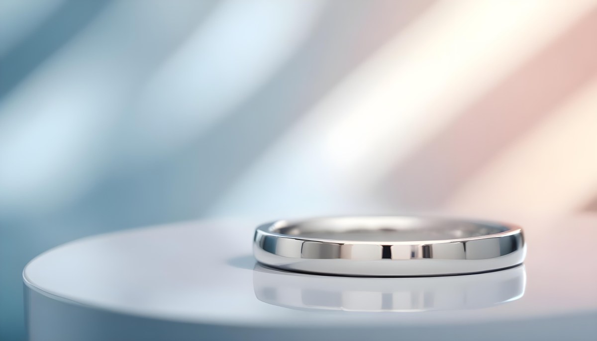 A Close Up View Of A Silver Metal Ring Or Band On A Reflective Surface 6 9e95