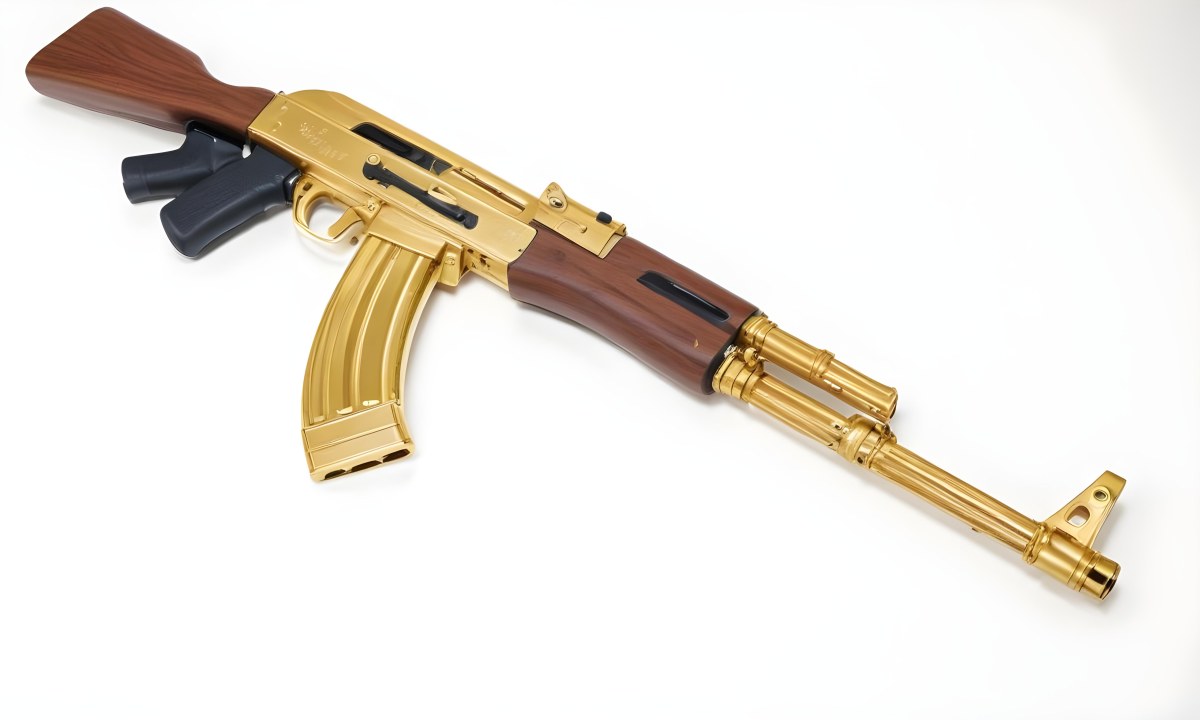 A Golden Ak 47 Assault Rifle With A Wooden Stock Featuring Silver Accents And A Synthetic Stock Set Against A Desert Landscape 7 Ebd3