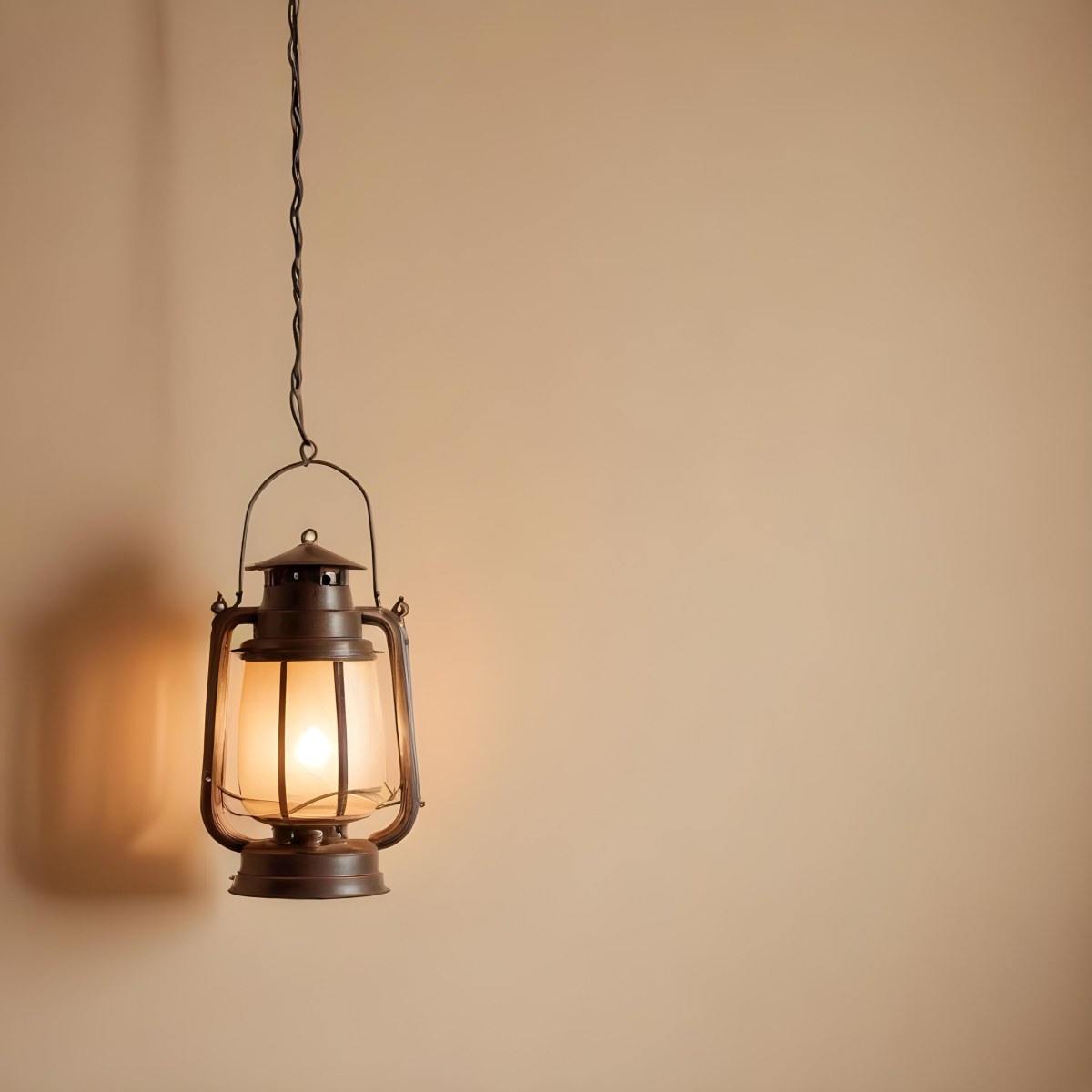 A Hanging Lantern With A Warm Glowing Light Against A Plain Beige Wall 8 A327
