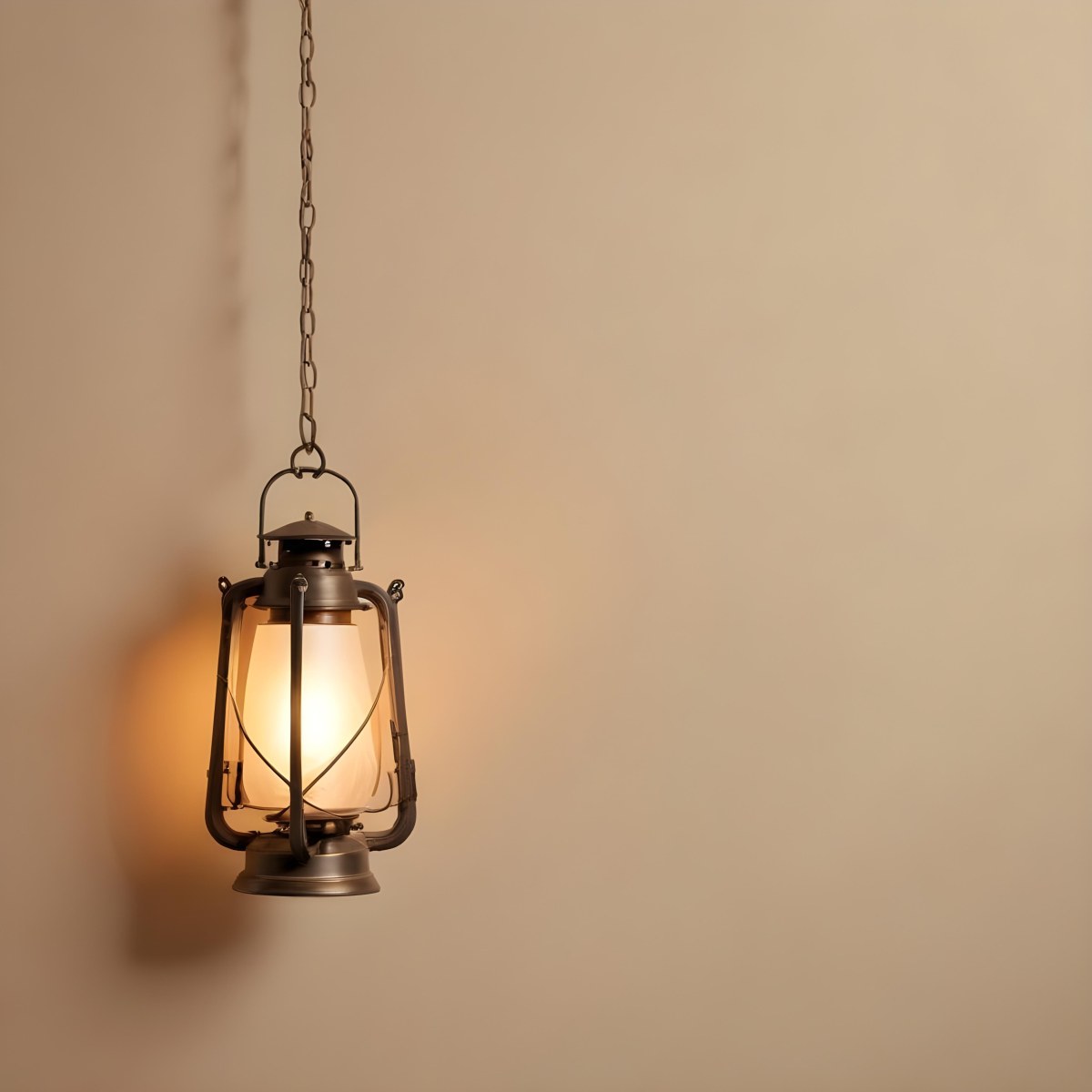 A Hanging Lantern With A Warm Glowing Light Against A Plain Beige Wall 9 54a0