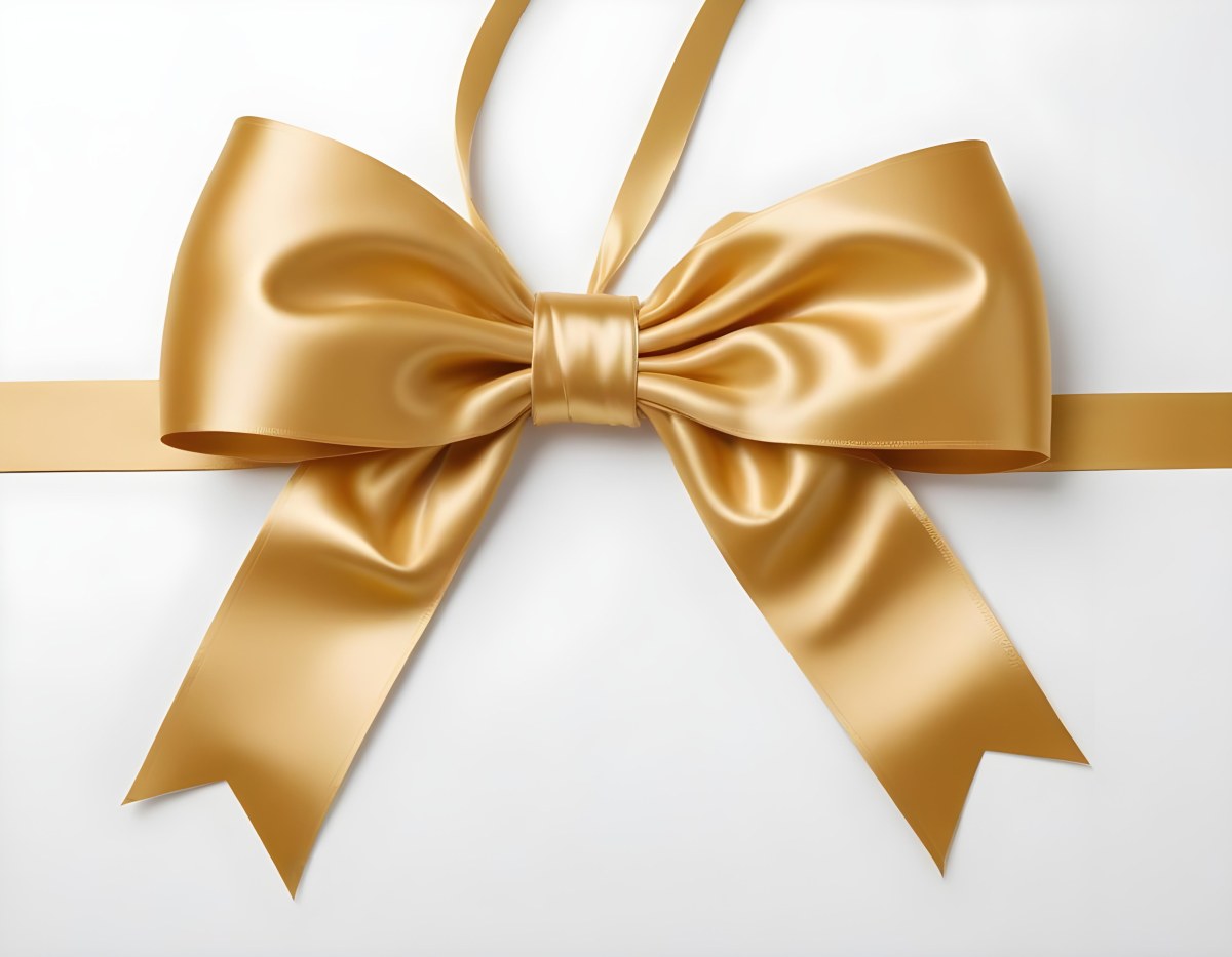 A Large Shiny Golden Bow Made Of Satin