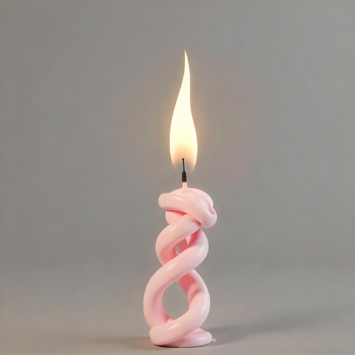 A Pink Spiral Candle With A Bright Flame On Top Casting A Bright Glow Simple Gray Background 10 E09b